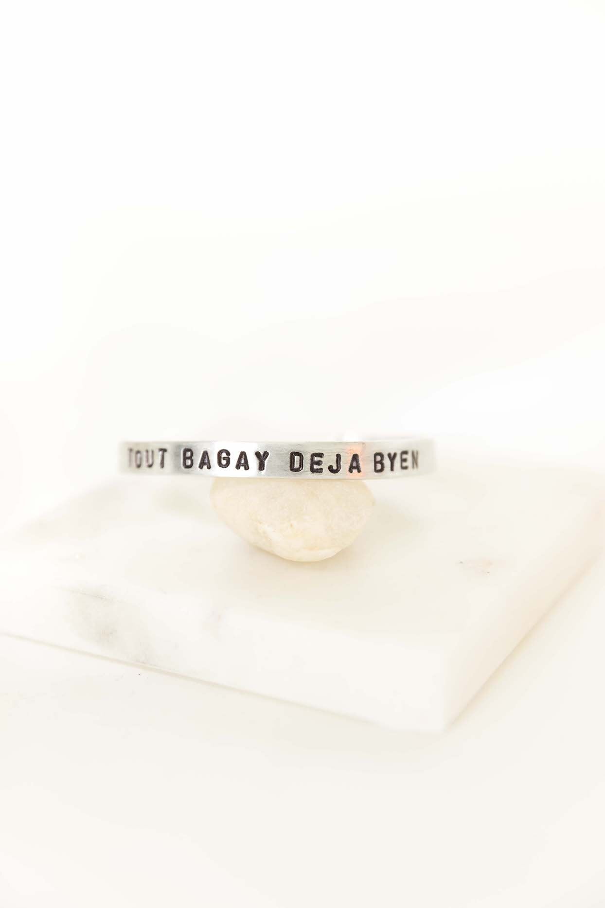 Aluminum Story Cuff - Haitian Phrases