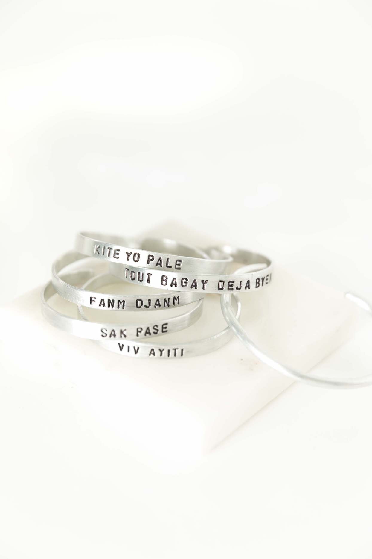 Aluminum Story Cuff - Haitian Phrases